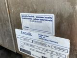 a label on the side of a stainless steel refrigerator
