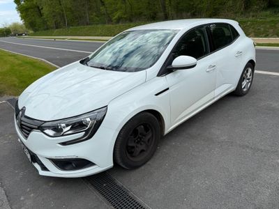 a picture of a white car parked on the side of the road