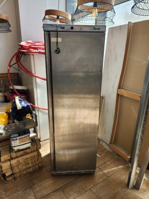 an image of a stainless steel refrigerator in a kitchen