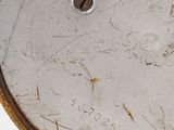 an image of a close up of a clock on a white surface
