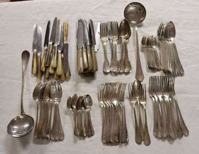 a lot of silver spoons and forks on a table