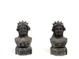 pair of cast iron busturines of a woman and a man