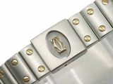 a close up of a bracelet on a white surface