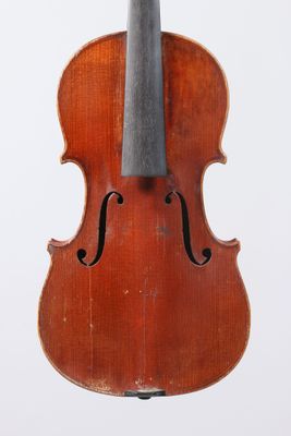 an old violin with a bow hanging from it ' s back