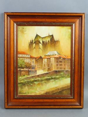 an oil painting of a castle in a wooden frame on a wall
