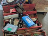 many boxes of tools in the garage on the floor