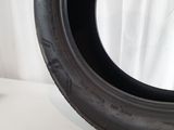 a close up of a tire tire on a white surface