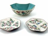 two bowls and a bowl on a white surface with a blue background