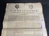 an old document with a seal on it sitting on top of a table