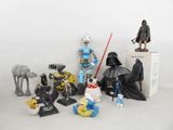 a lot of star wars action figures on the table