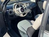 the interior of a car with the door open and the driver ' s seat up