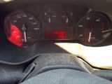 a close up of a car dashboard with a clock on it