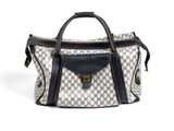 un sac à main blanc et noir avec une poignée noire sur fond blanc