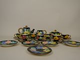 a lot of plates and cups that are on the table