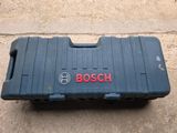 a close up of a blue case with a red logo on it