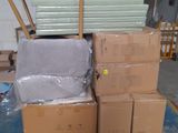 a pile of boxes sitting on a pallet in a warehouse