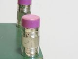 two pencils that are sitting on top of a table