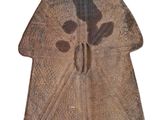 an image of a piece of wood with a face on it