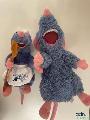 two stuffed animals that are sitting next to each other