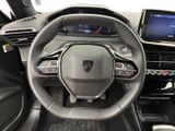 the interior of a car with a steering wheel and dashboard controls