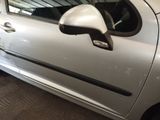a silver car that is parked in a garage