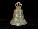 a bell with a crown on top of it on a black background