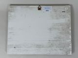 an image of a piece of white wood hanging on a wall