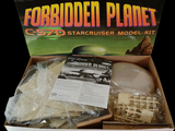 a cardboard box with a starcruiser model inside of it
