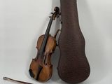 a violin that is sitting next to a violin case
