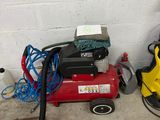 a picture of a red air compressor and a yellow vacuum