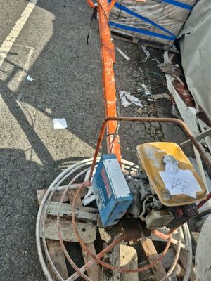 a small machine that is sitting on the side of the road