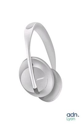 a pair of headphones sitting on top of each other on a white surface