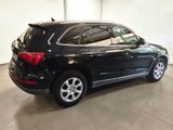 a picture of a black suv parked in a garage