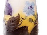 a vase with flowers and leaves on it on a white background