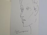 a drawing of a man ' s face on a piece of paper