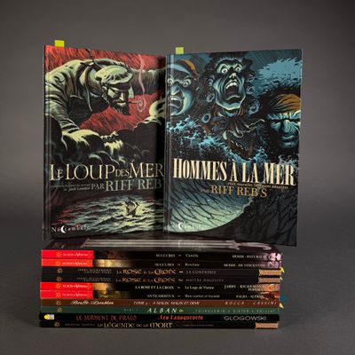 the books are stacked on top of each other on a table