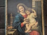 an image of a painting of a woman holding a child in her lap