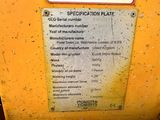 a sign on the side of a yellow machine