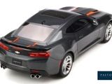 a toy car that is sitting on a white surface