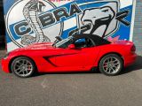 a picture of a red sports car parked in front of a cobra cobra cobra cobra cobra cobra cobra cobra cobra cobra cobra cobra cobra cobra cobra cobra cobra cobra