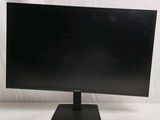 a close up of a computer monitor on a stand on a white surface