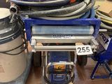 a lot of hoses on a cart in a room