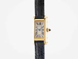 a close up of a wrist watch with a black strap