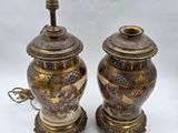 pair of asian vases with asian scenes on them on a white background