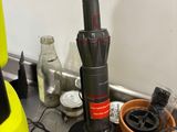yellow and black blender sitting on top of a counter next to a potted plant