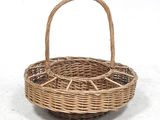 a close up of a wicker basket on a white surface