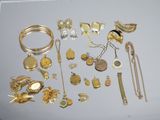 a lot of gold jewelry on the table