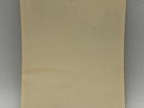 a close up of a piece of paper on a white surface