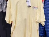 a display of clothing on a rack in a store
