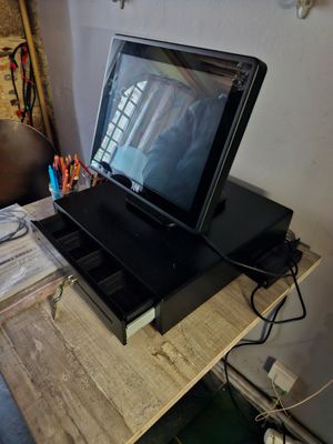 a laptop computer sitting on top of a wooden desk